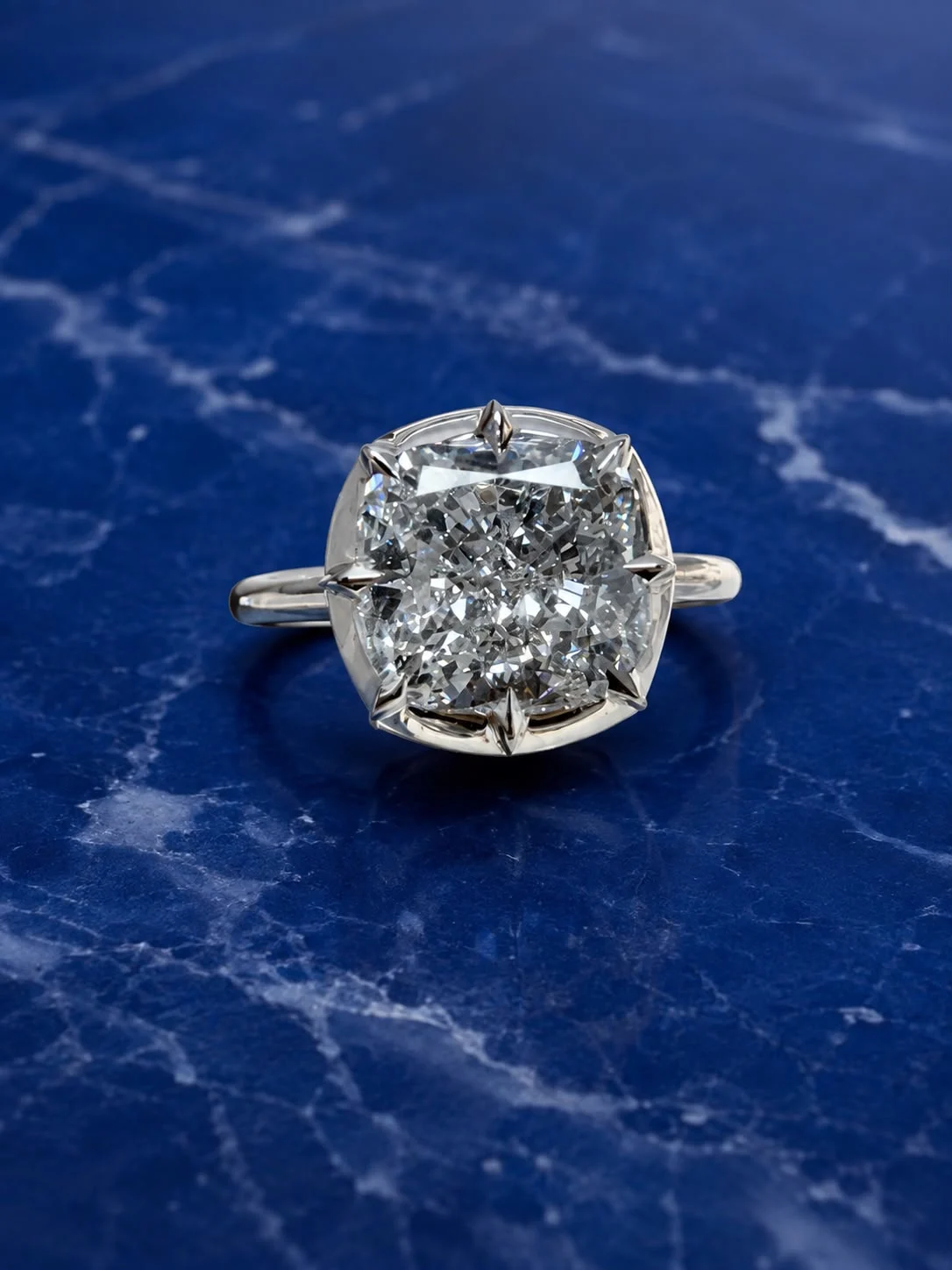 Cushion crown solitaire engagement ring with a cushion-cut lab grown diamond center