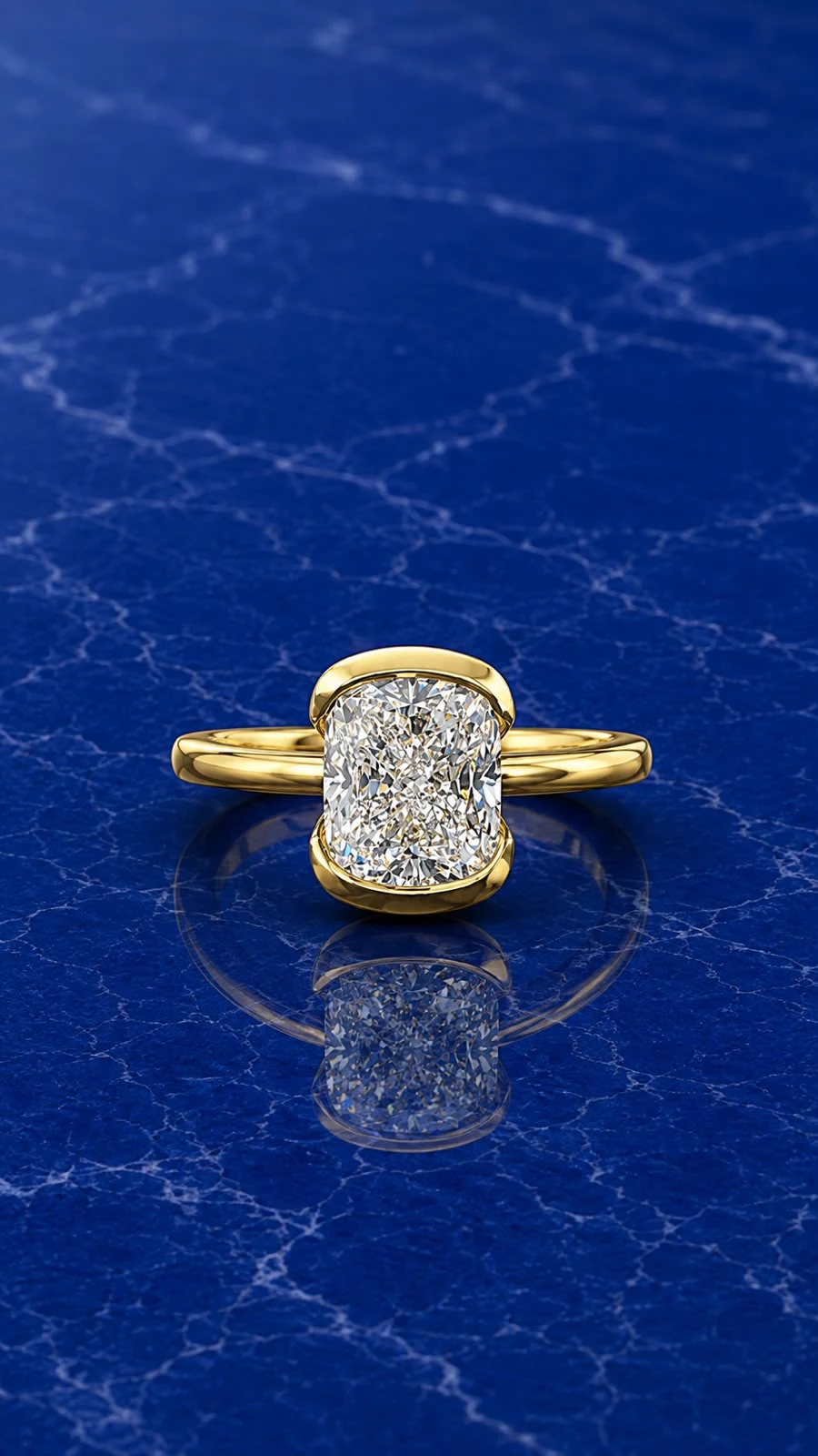 Cushion half bezel set engagement ring with a cushion-cut lab grown diamond center