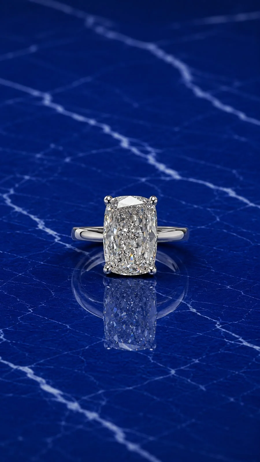 Cushion solitaire engagement ring with a cushion-cut lab grown diamond center