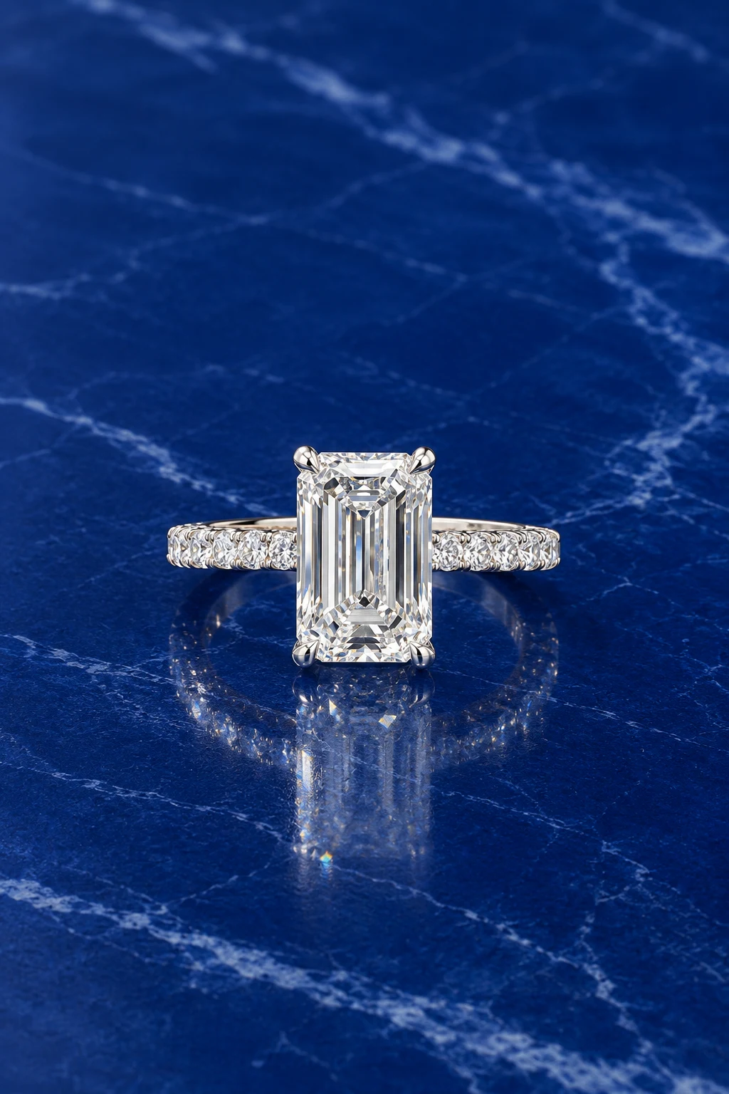 Emerald-cut lab grown diamond ring with classic pave band