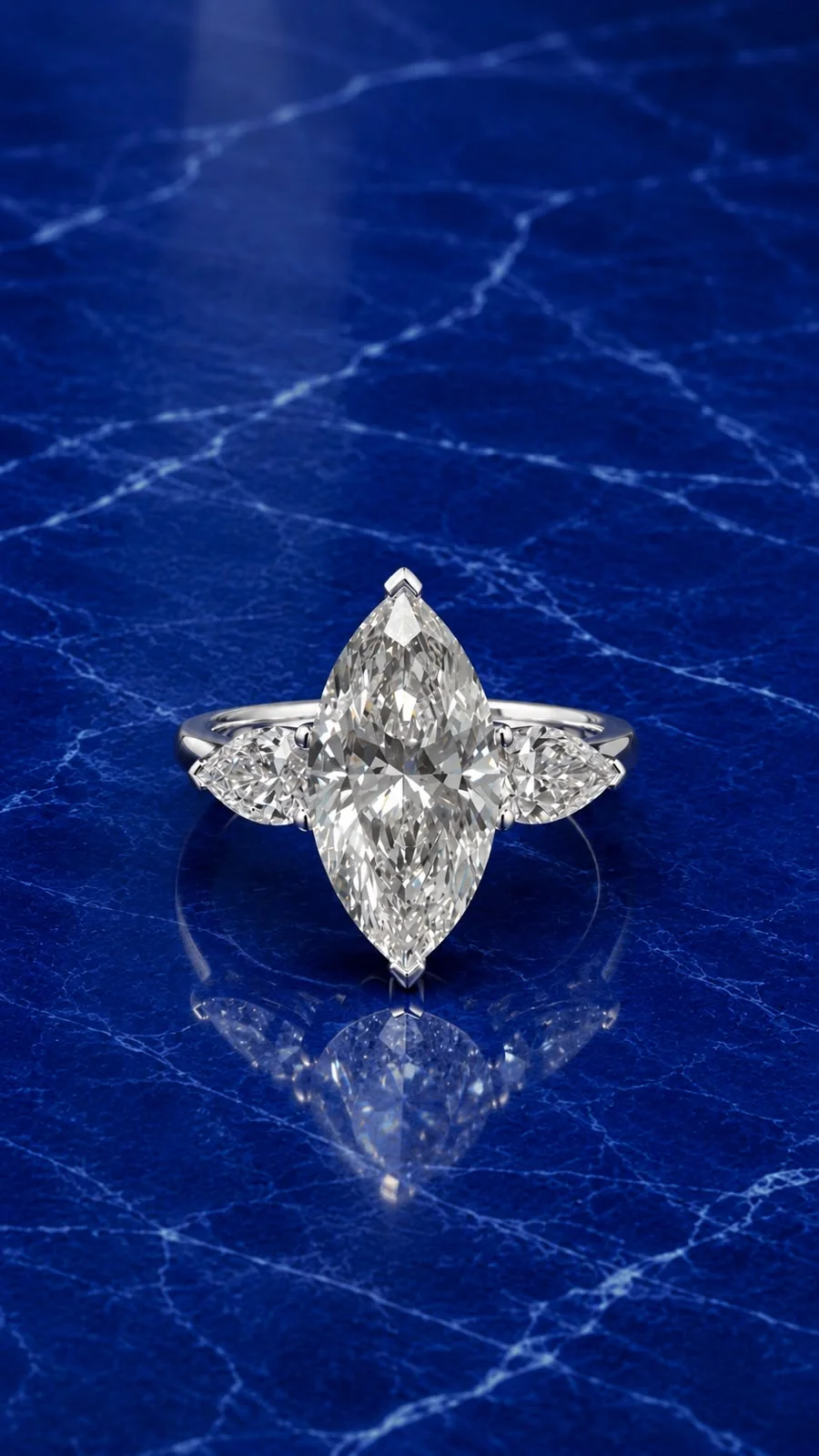 Three stone engagement ring with marquise and pear cut lab grown diamonds