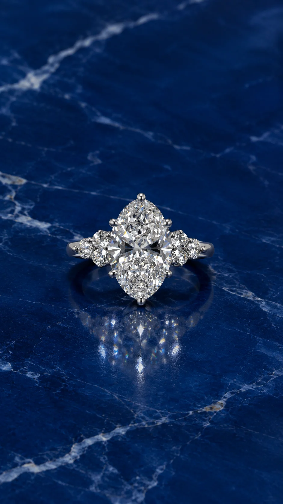 Oval cluster engagement ring featuring an oval-cut lab grown diamond center stone
