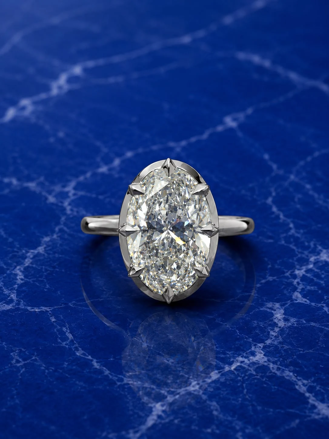 Oval crown solitaire engagement ring with an oval-cut lab grown diamond center