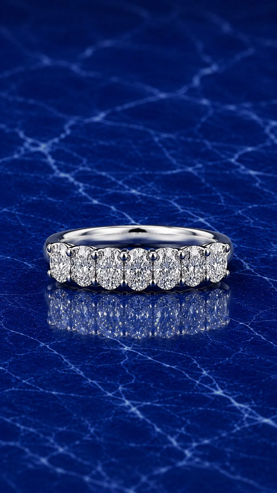 Oval lab grown diamond half eternity band set in 14k gold