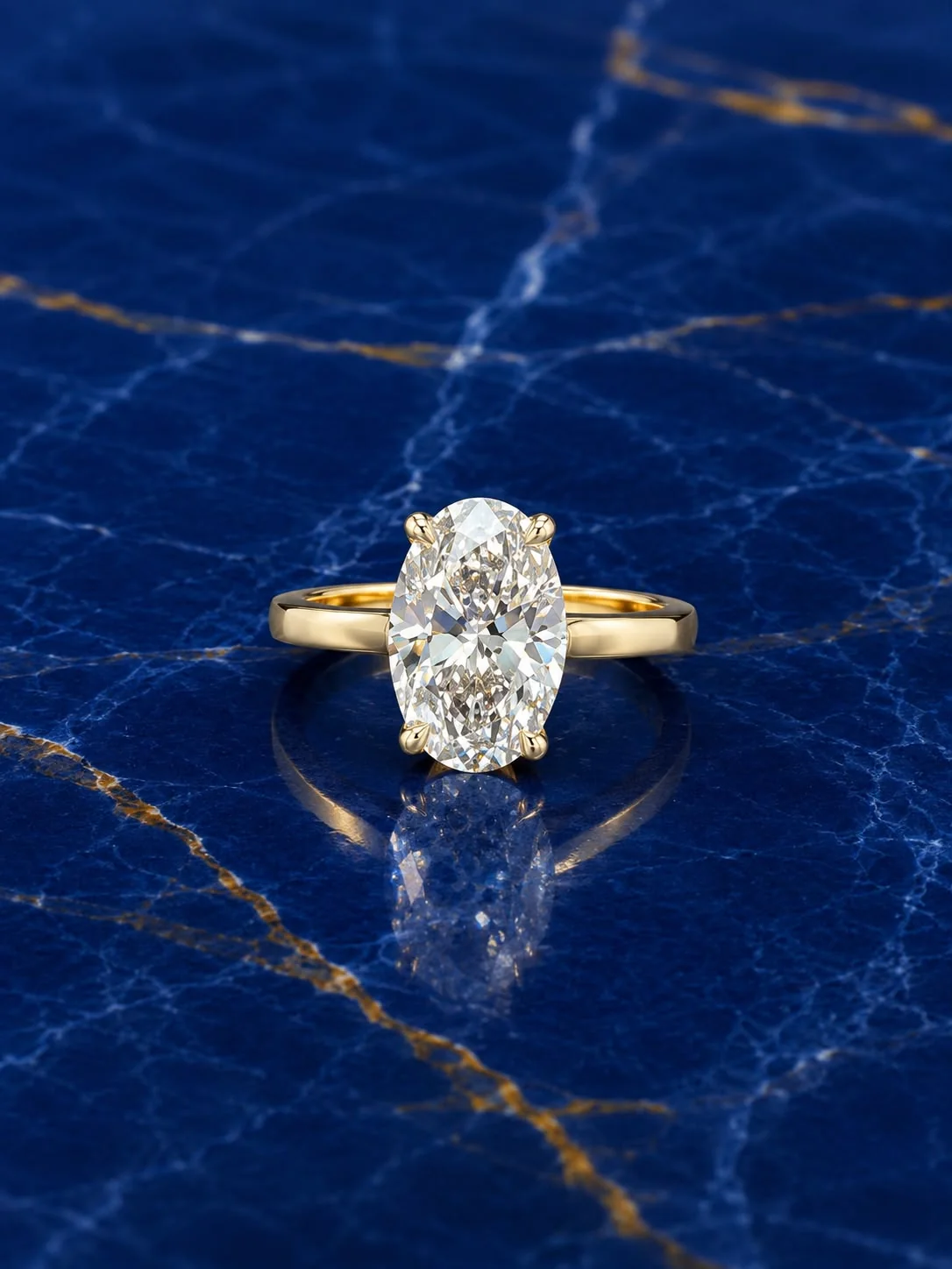 Classic oval solitaire engagement ring with an oval-cut lab grown diamond center