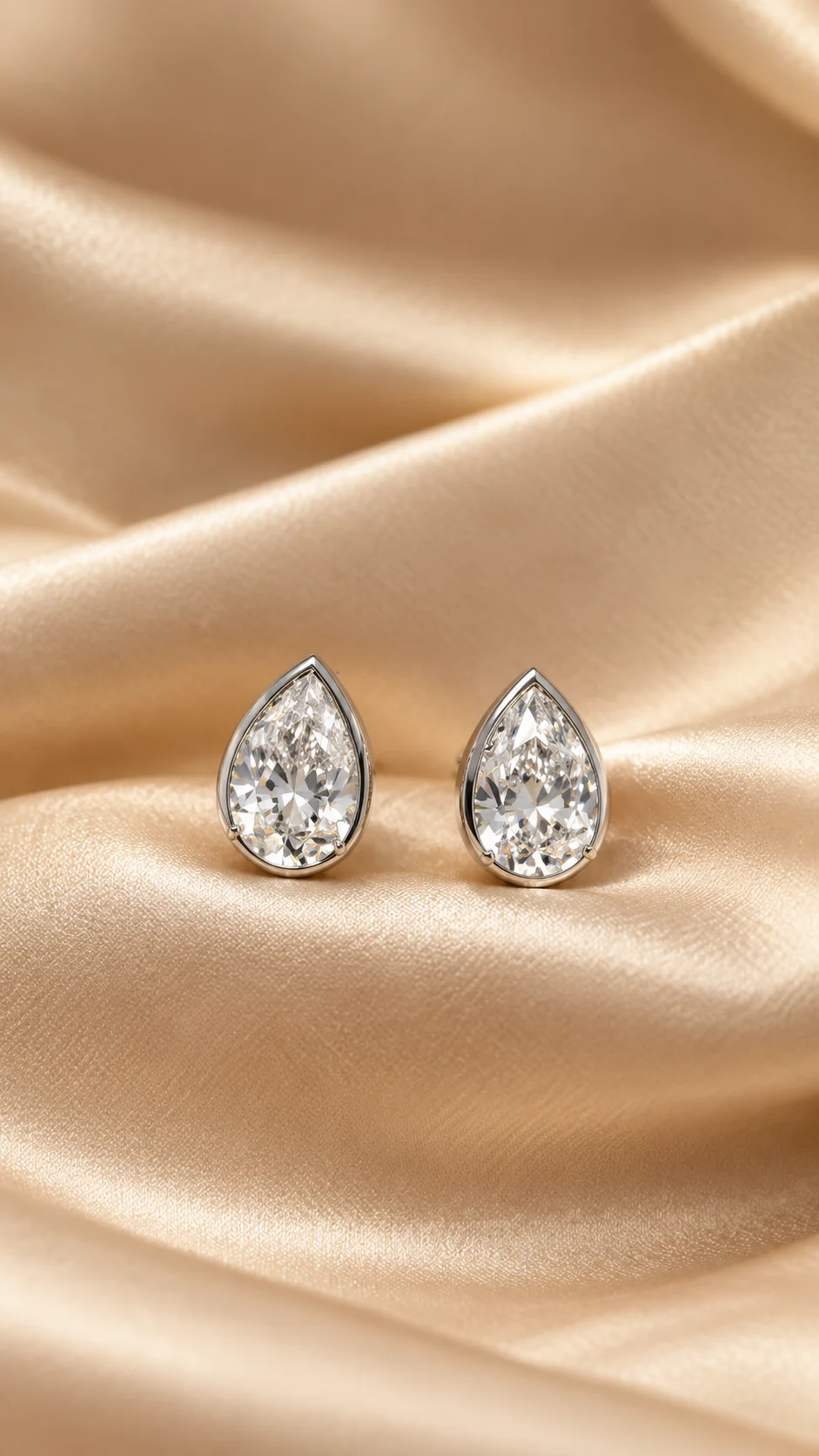 Pear cut lab grown diamond studs in 14K gold