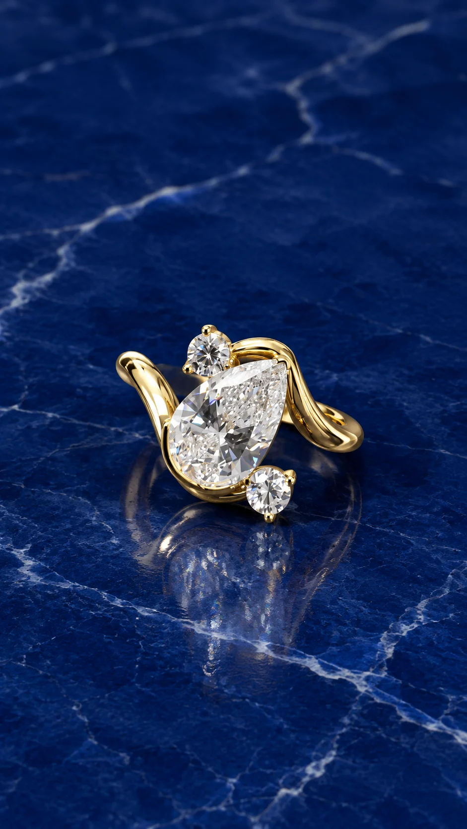 Pear bypass engagement ring featuring a pear-cut lab grown diamond center stone