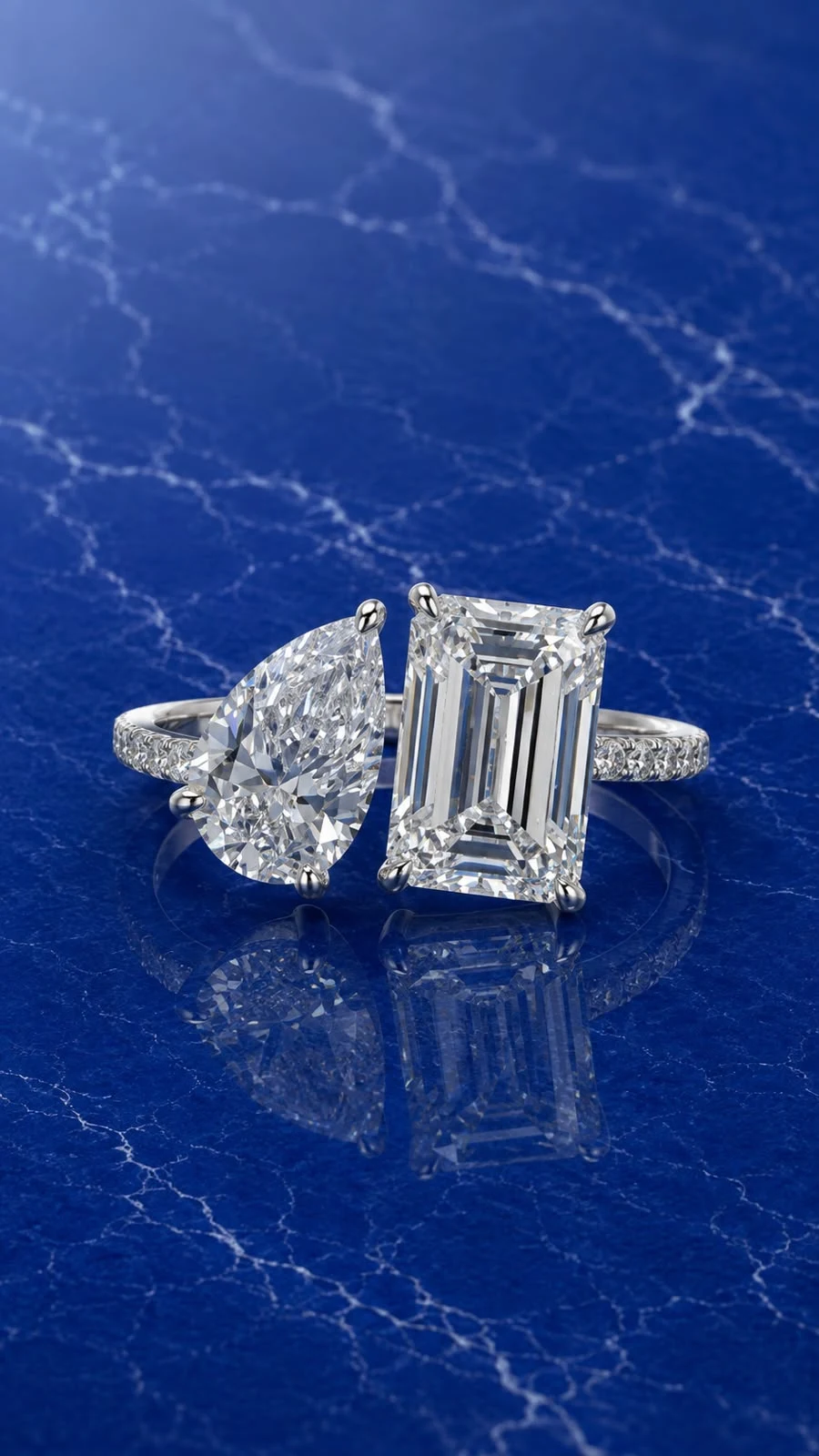 Pear Emerald Toi et Moi Ring with a pear and emerald cut lab grown diamond center