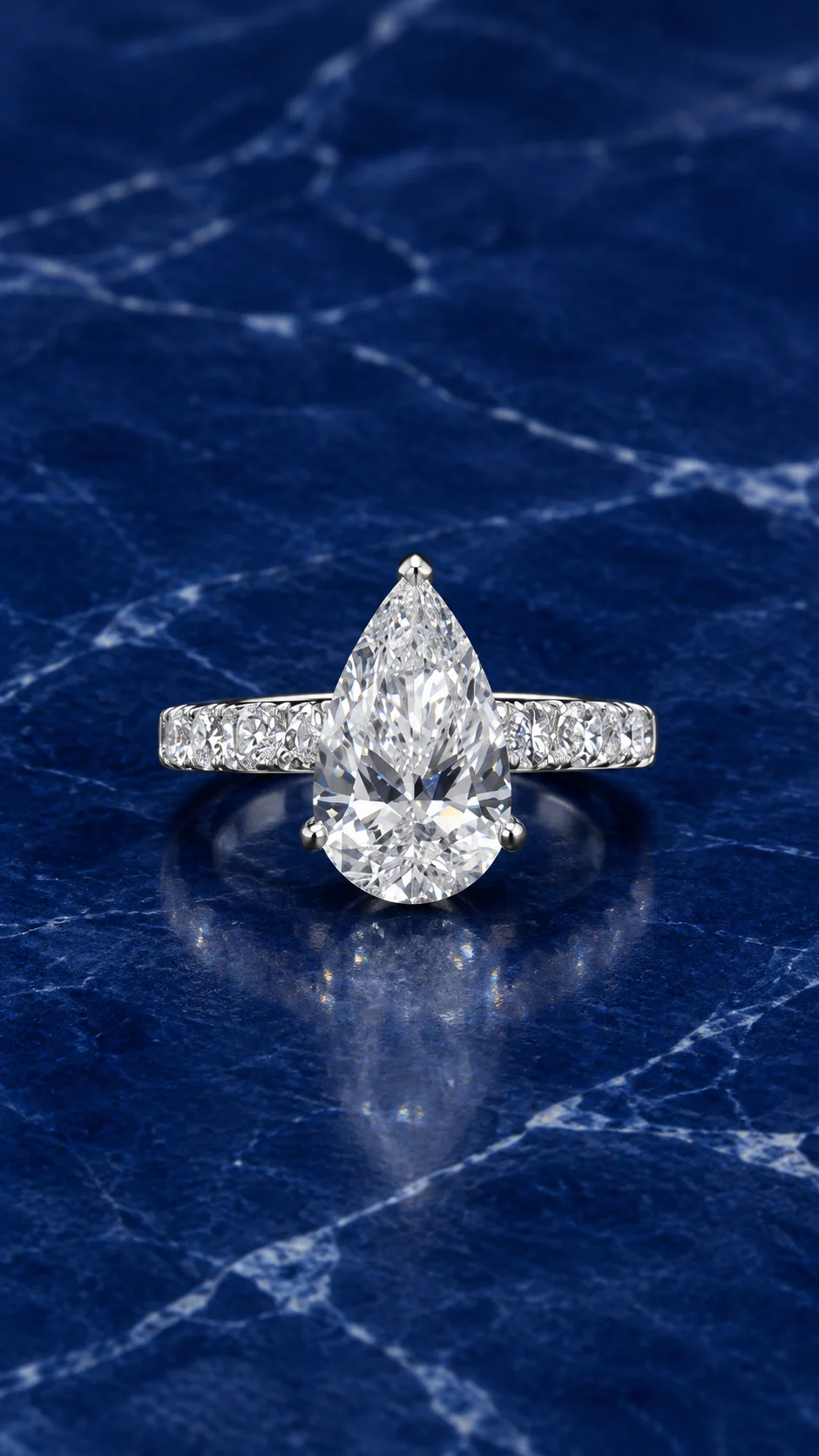Pear-cut lab grown diamond ring with classic pave band