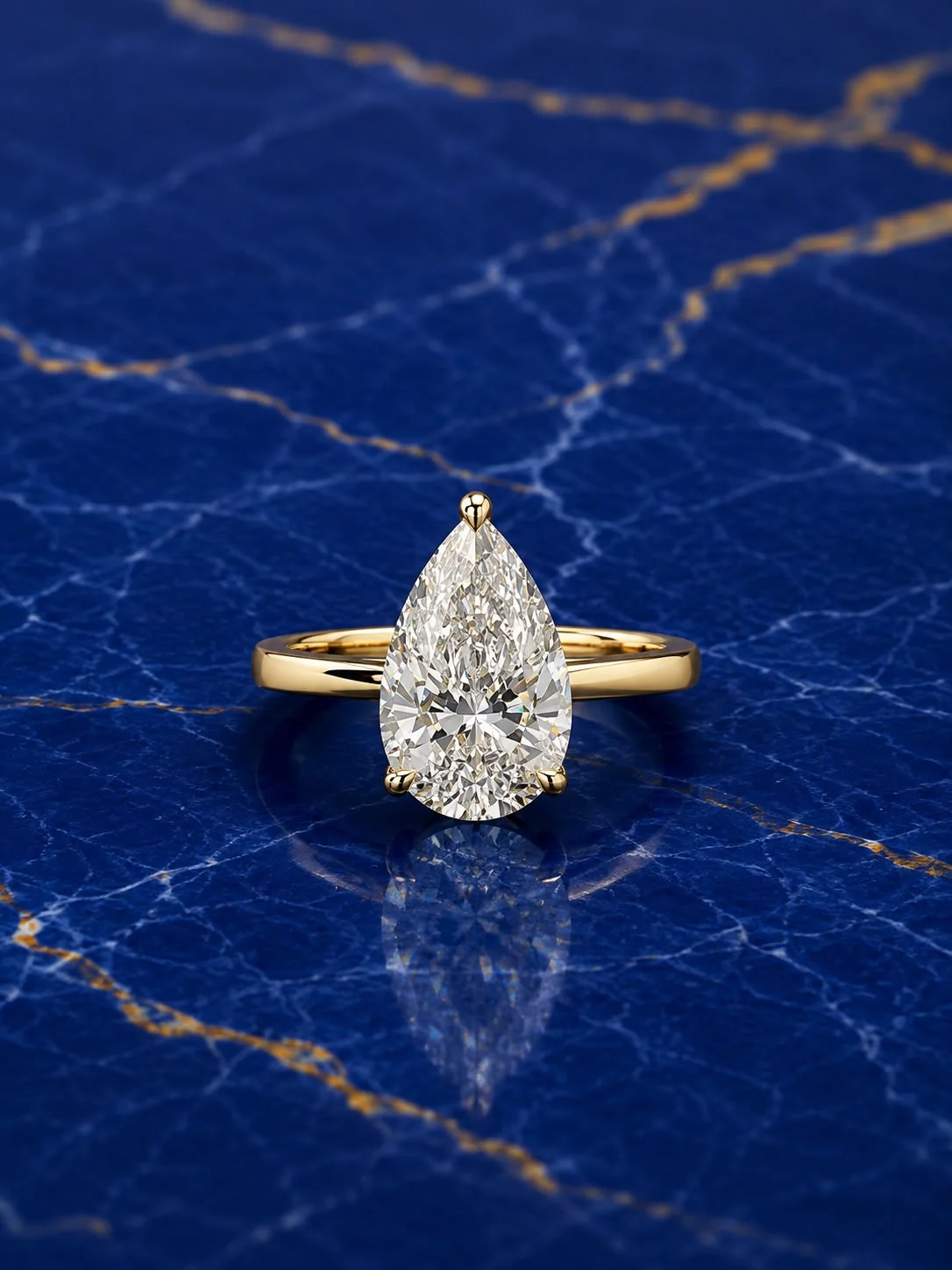 Pear solitaire engagement ring with a pear-cut lab grown diamond center